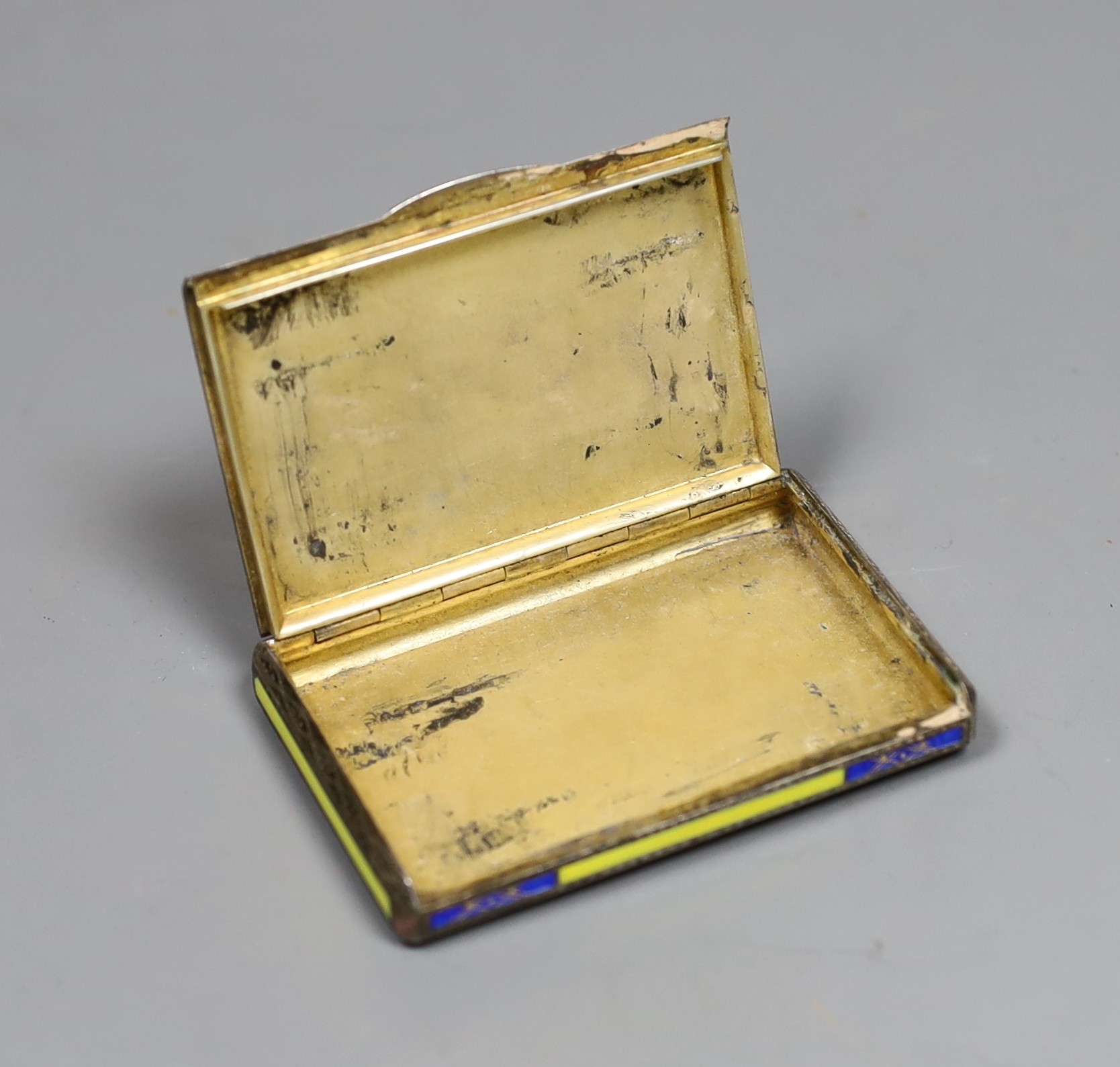 A George V silver and two colour enamel rectangular cigarette case, import marks for Glasgow, 1926, 79mm.